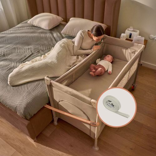 Beistellbett, das am Bett befestigt ist.